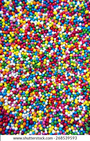 Mix of colorful Sugar balls powder background