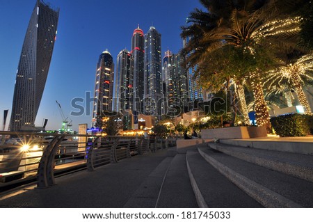 Skyscrapers of Dubai Marina captured in the dusk. Dubai Marina is an artificial canal city, carved along a two mile stretch of Persian Gulf shoreline.