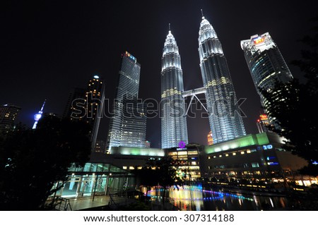 KUALA LUMPUR, MALAYSIA - CIRCA JULY 2015: Petronas Twin Towers at night circa July 2015 in Kuala Lumpur. Petronas Twin Towers were the tallest buildings (452 m) in the world from 1998 to 2004.