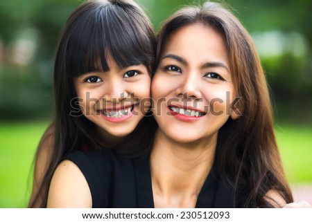 Happy mother and child girl, Outdoor