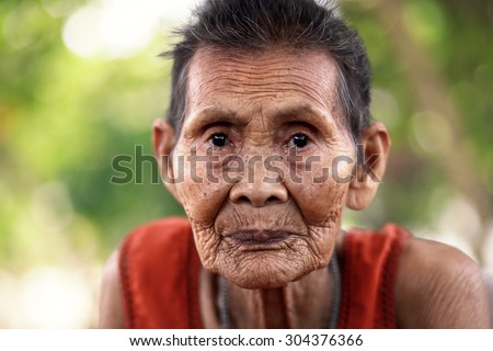 Close up face of old asian woman with wrinkles elderly senior