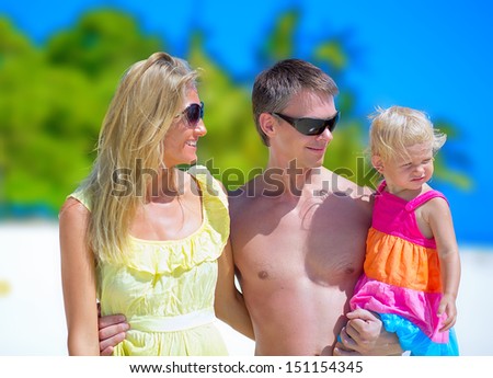 Family of three having tropical vacation on Maldives