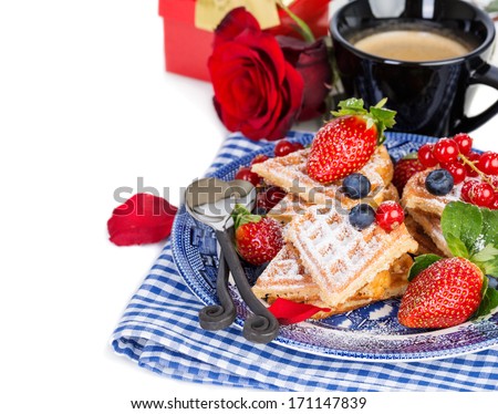 Heart shaped waffles and coffee for romantic breakfast with strawberries, red rose and gift box, valentines day. Over white background, isolated, with copy space.