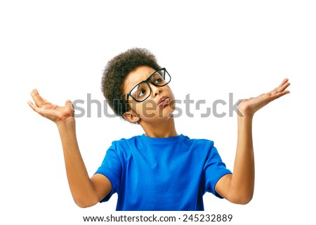 Shrugging African American boy in doubt doing shrug showing open palms. School boy, teenager with eyeglasses. Boy choosing Isolated, over white background.