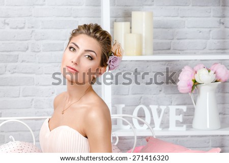 Beautiful bride with romantic look. Pink dress, wedding hairstyle and make-up.