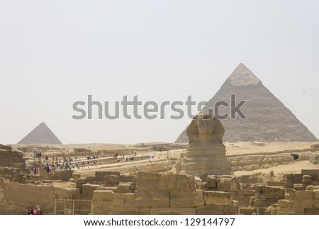 The front of the great Sphinx and the pyramid of Khafre and Menkaure behind it