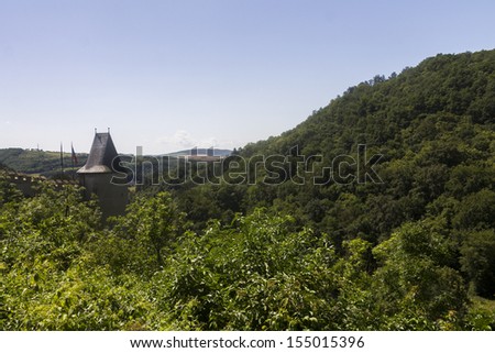 View from the KarlÃ?Â¡tejn Castle on the surrounding nature and a small village under it. It is one of the most famous and most frequently visited castles in the Czech Republic.