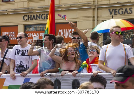 PRAGUE - AUGUST 15, 2015: People on rainbow decorated cars wawing the crowd during the fifth Prague Pride 2015 with up to 35,000 people marching through the city Prague to Letna park.