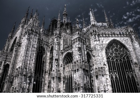 HDR vivid photo of the famous Cathedral Duomo di Milano on piazza in Milan, Italy