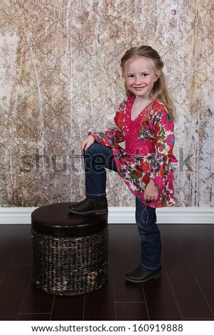 Beautiful Little Girl Posing for Camera in Studio