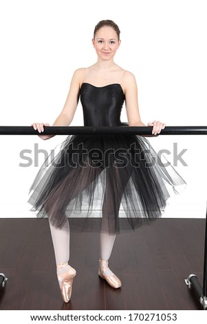 Ballerina dancing in studio with white background