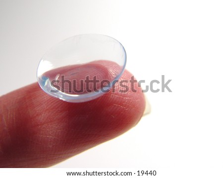 Closeup of a contact len on a finger