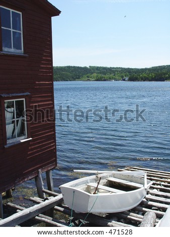 Rural Newfoundland Stage by the Ocean with boat on slip