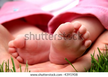 Baby Girl little toes in mother hands
