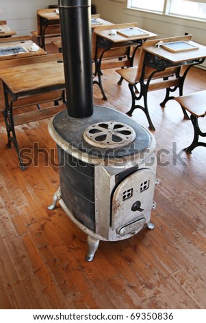 Inside of old school house with old wood stove