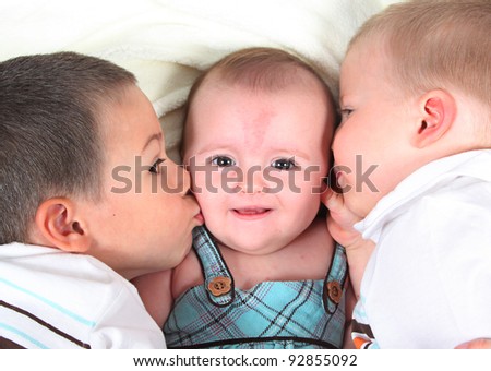 Two boys Kissing there Sister taken closeup