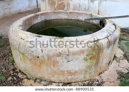 Big cement well with watter in burmese village, Myanmar