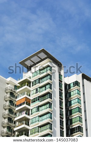 high rise apartments with clear blue sky