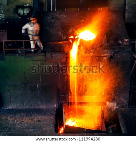 Pouring of liquid metal in open hearth workshop