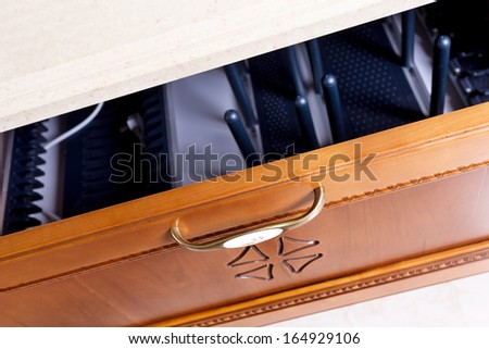 wooden cupboard with opened empty drawer