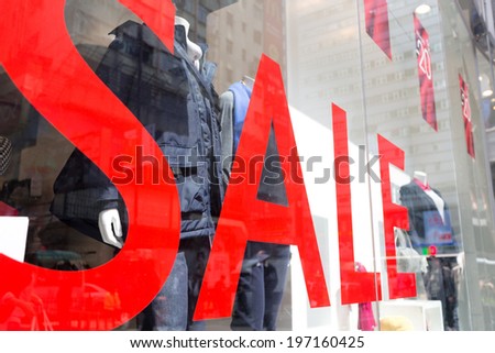 Sale Sign In A Clothing Store Window