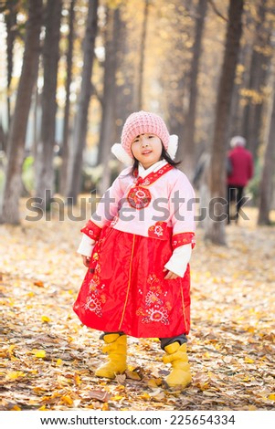 little girl enjoy new year  costume and happily play in forest