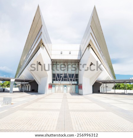 kallang,Singapore-July 1,2014: panoramic skyline and singapore indoor stadium exterior.Singapore Indoor Stadium is an indoor sports arena, located in Kallang,