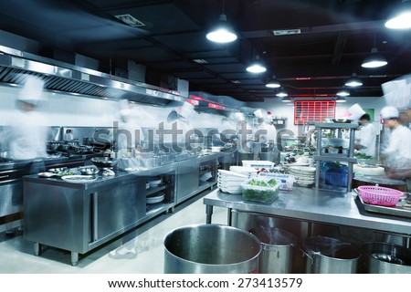 Modern kitchen and busy chefs in hotel