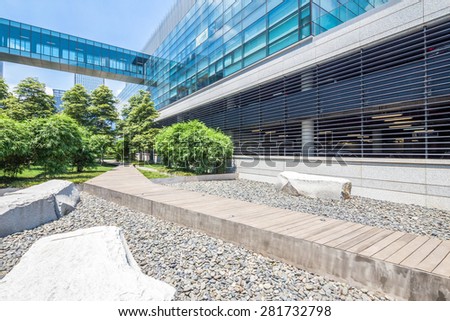 Chengdu,China-July 23,2014:modern building and green footpath in chengdu.It\'s the epitome of fast development in southwest china.