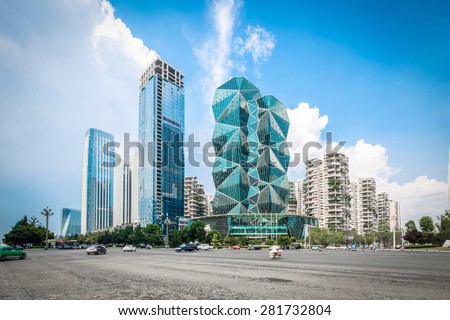 Chengdu,China-July 23,2014:modern buildings and empty road in chengdu.It\'s the epitome of fast development in southwest china.
