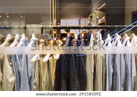 clothes on hanger in modern fashion shop