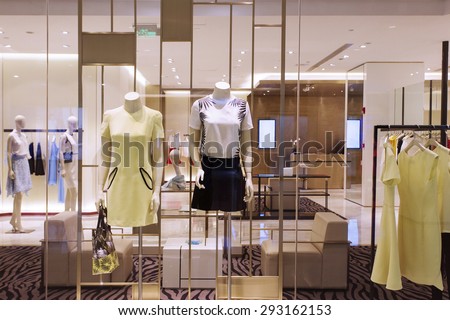 mannequins and clothes in fashion shop