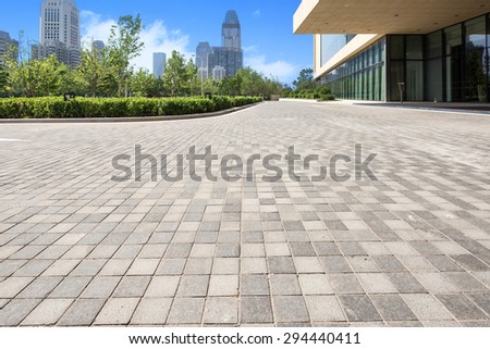 office building exterior with brick road floor