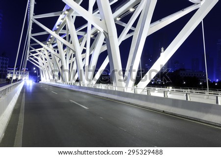 modern bridge with empty road floor at night