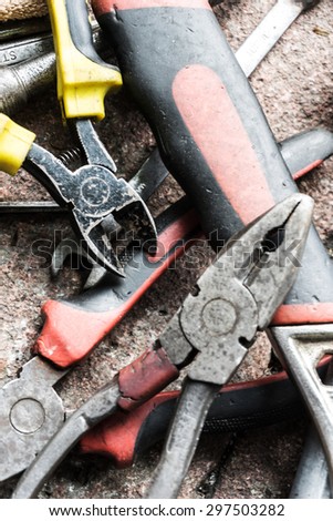 closeup view of work tools on brick ground