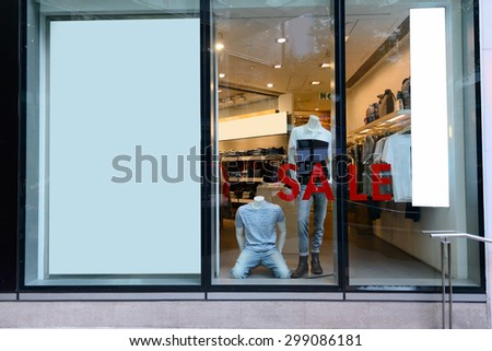 sale word on shopfront display window
