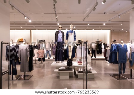 beautiful clothes in modern fashion shop 商業照片 © 