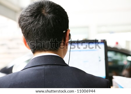businessman\'s back before pc