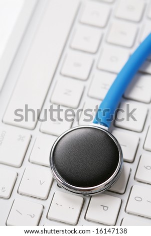 stethoscope by a computer keyboard