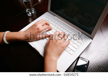 Close-up of secretary\'s hand touching computer keys during work