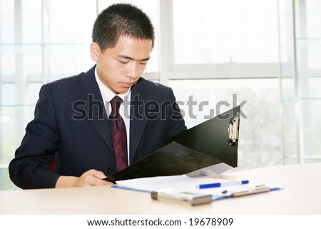 young handsome asian business man working  in office
