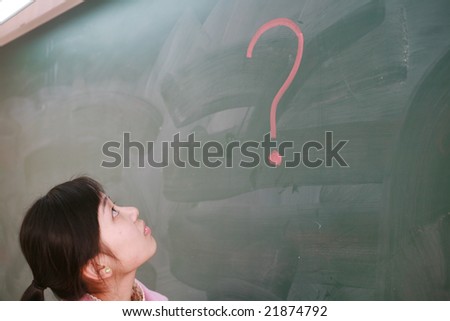 asian girl  with a red question mark on blackboard
