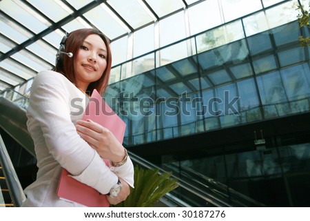 young Beautiful asian Customer Representative holding with folder