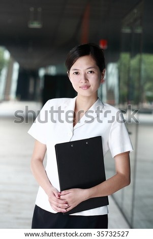 young asian business woman holding with folder