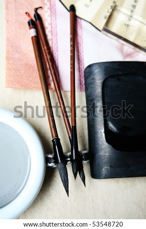 Chinese writing brushes and inkstone on the table