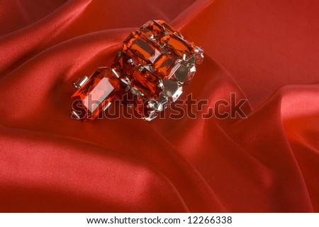 crystal bracelet and ring on red satin