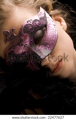 blond woman wearing purple Venetian mask and black feathers