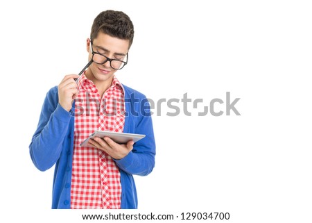 Fashionable nerd guy thinking and holding digital tablet