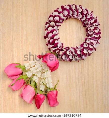 Thai flower garland on wood background