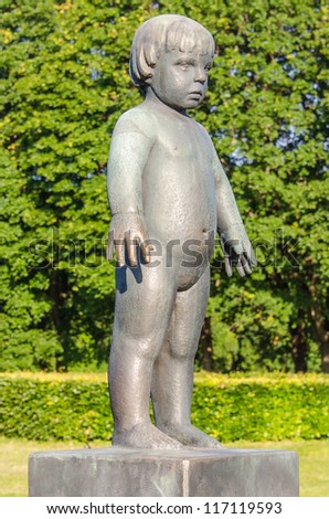 OSLO, NORWAY - JUNE 21: Baby girl statue at Frogner Park in Oslo, Norway on June 21, 2012. The park covers 80 acres and features 212 bronze and granite sculptures created by Gustav Vigeland.